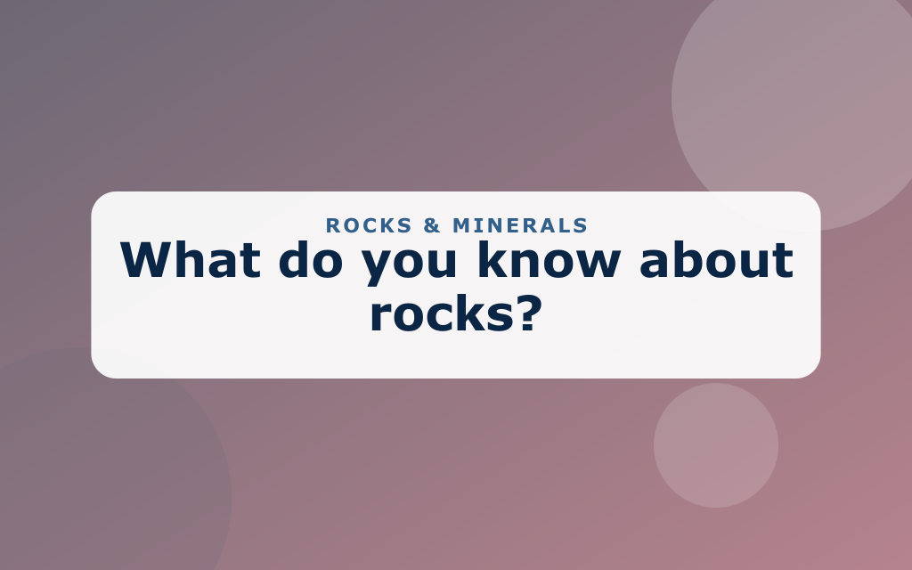 Cartoon rocks, pebbles, a crystal geode, and a magnifying glass